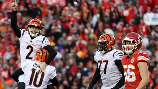 Evan McPherson (left) celebrates after kicking the winning field goal