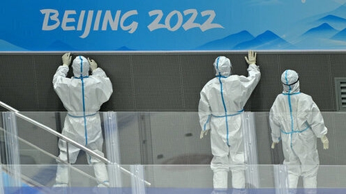 Workers clean the National Indoor Stadium in Beijing
