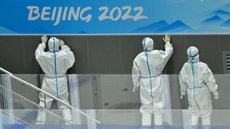 Workers clean the National Indoor Stadium in Beijing