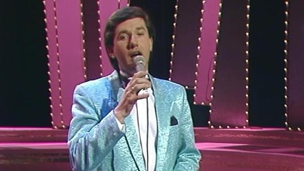 Daniel O'Donnell in a shiny turquoise jacket