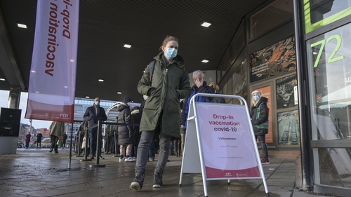 People pictured queueing for a Covid-19 vaccine in Stockholm last month