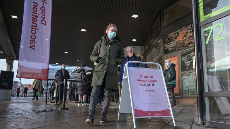People pictured queueing for a Covid-19 vaccine in Stockholm last month