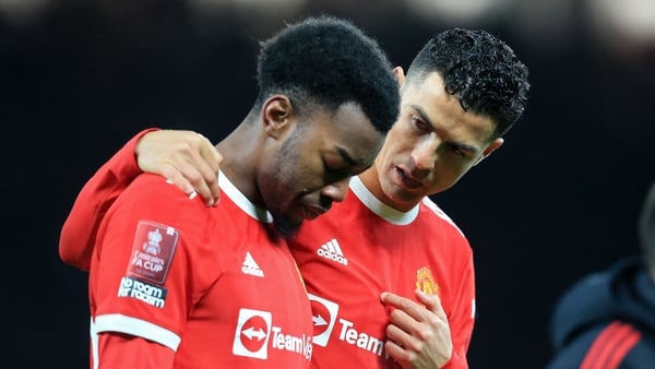 Ronaldo (R) consoles Anthony Elanga (L) after his penalty miss gave victory to Middlesbrough