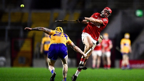 Cork's Ciaran Joyce gets a shot away despite the close attention of Aaron Fitzgerald