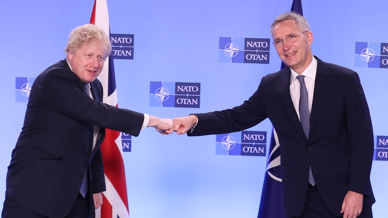 NATO Secretary-General Jens Stoltenberg (R) and UK Prime Minister Boris Johnson (L) meet at NATO headquarters in Brussels