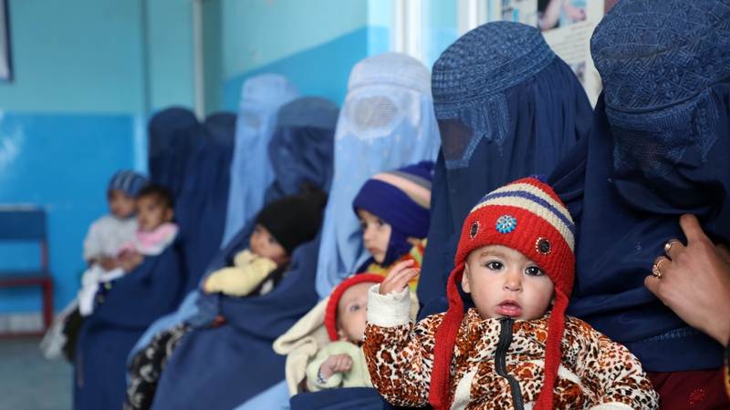 Women and children are pictured at a health centre in Kabul in January