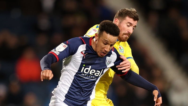 Ireland international Robinson shields the ball from Blackburn's Joe Rothwell