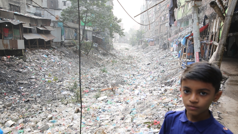 A canal that connects the river Buriganga is polluted by plastic and local garments waste in Dhaka, Bangladesh