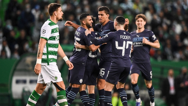 Riyad Mahrez celebrates with Man City team-mates after opening the scoring in Lisbon