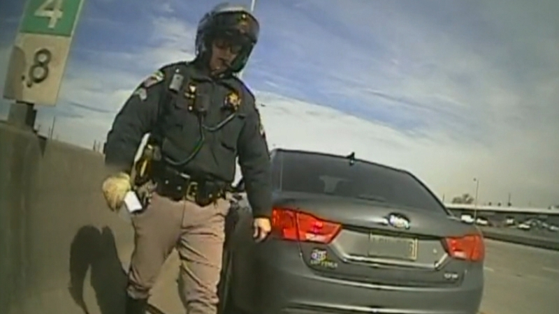 Lucky escape: The state trooper has just issued a ticket when the collision occurred.