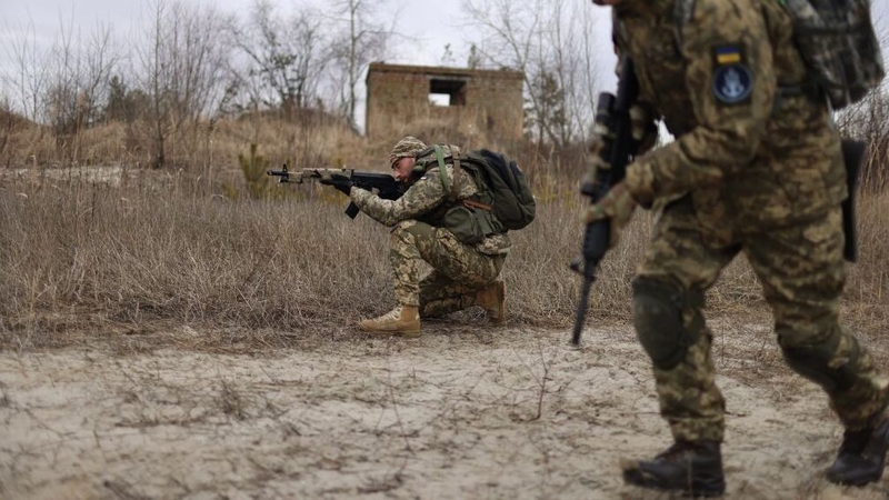 Members of Ukraine's Territorial Defense Forces participate in a drill during training