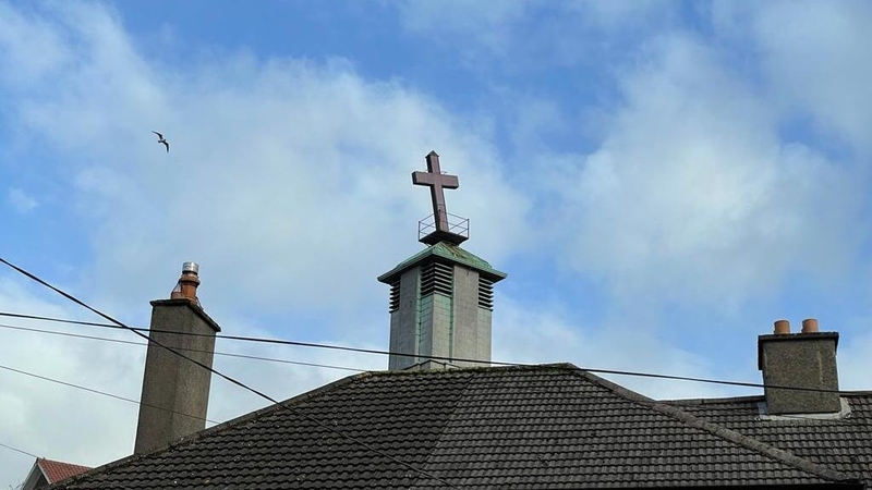 The 15-foot-high cross can be widely seen on its site above the city