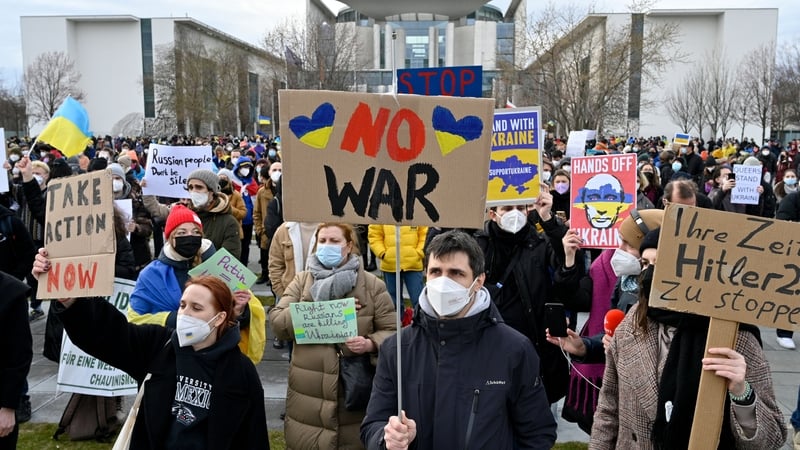 People protest against Russia's invasion of Ukraine in front of the Chancellery in Berlin earlier today