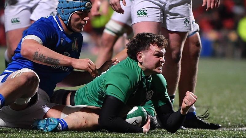 Lorcan McLoughlin celebrates after scoring Ireland's third try