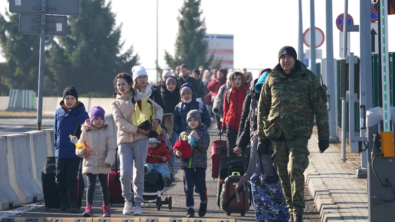 Women and children from Ukraine cross the border into Poland