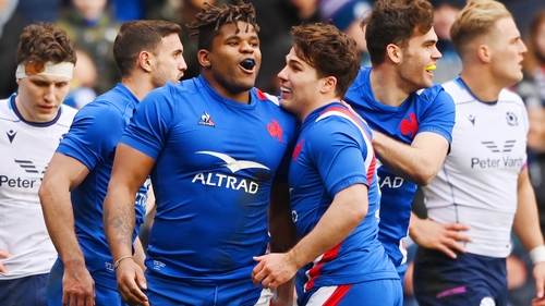 Jonathan Danty (centre) celebrates with Antoine Dupont after scoring France's fourth try