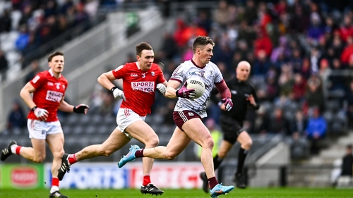 Galway's Shane Walsh (R) is chased by Cork's Kevin Flahive