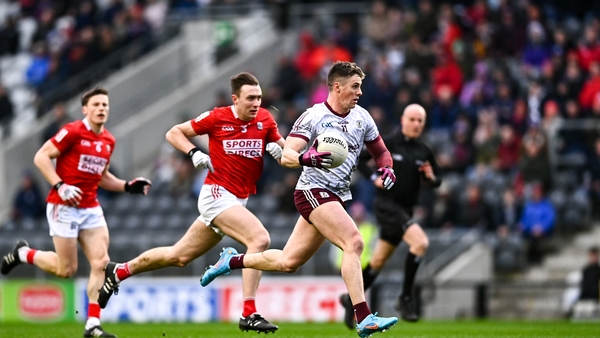 Galway's Shane Walsh (R) is chased by Cork's Kevin Flahive