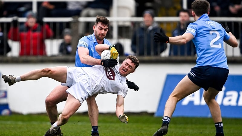 Kildare's Jimmy Hyland is tackled by Seán McMahon of Dublin