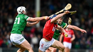 Sean O'Donoghue of Cork of Cork is tackled by Aaron Gillane, left, and Darragh O'Donovan of Limerick