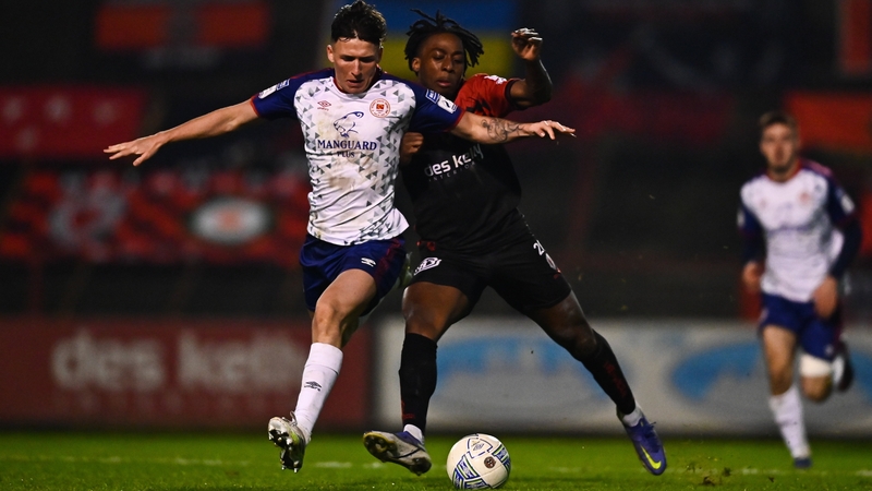 Saints defender Joe Redmond in action against Bohs forward Promise Omochere on Monday night