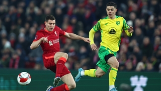 James Milner battles for possession with Milot Rashica.
