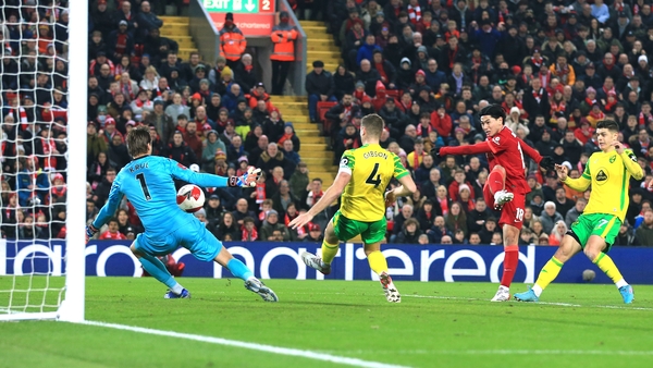 Takumi Minamino scored twice in the first half to send Liverpool through