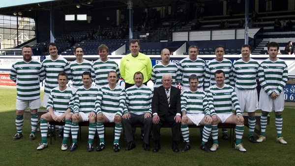 Frank Connor poses with a Celtic squad ahead of a charity match
