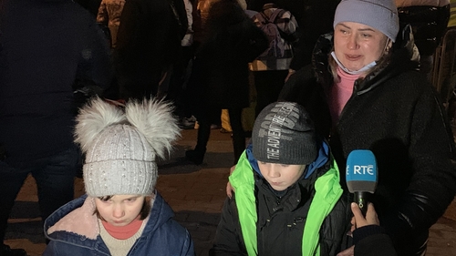 Masha, her brother Kiril, and mother Alina at the Poland/Ukraine border