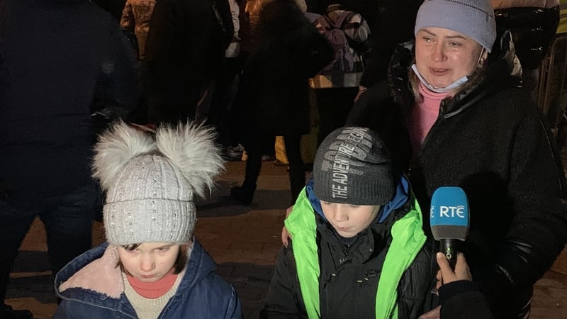 Masha, her brother Kiril, and mother Alina at the Poland/Ukraine border