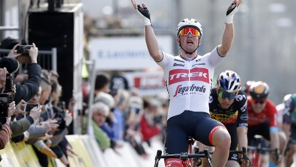 Mads Pedersen celebrates at the finish line.