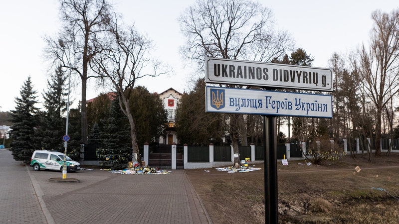 Workers have put up two new signs with the name in Lithuanian and Ukrainian