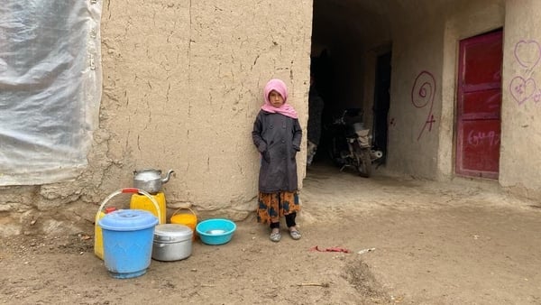 Eight-year-old Rabia pictured standing outside her house, located in one of Afghanistan's poorest regions