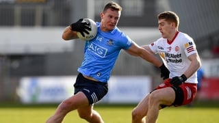 Ciarán Kilkenny gets away from Tyrone's Peter Harte