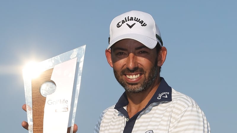 Pablo Larrazabal celebrates with the winner's trophy