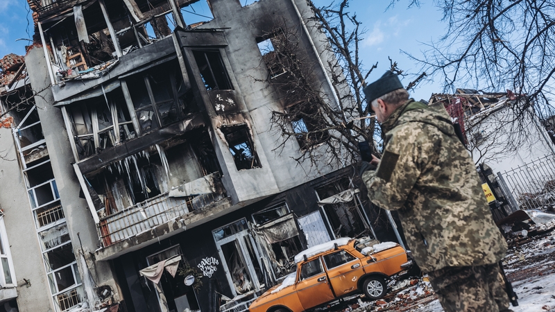 A soldier in front of a destroyed building in Kharkov, Ukraine, yesterday as Russian attacks continue