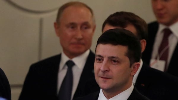 A date is expected to be set to hold a meeting between Vladimir Putin (L) and Volodymyr Zelensky (R) (file pic)