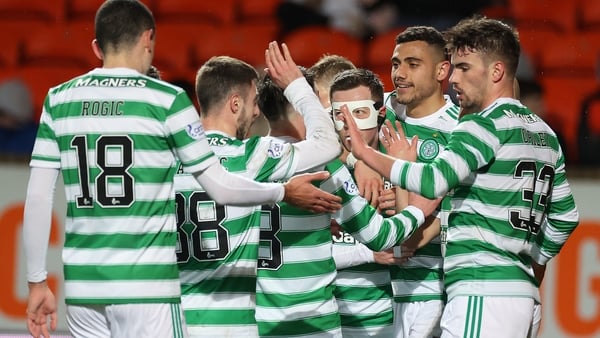 Giorgos Giakoumakis is mobbed after scoring his side's second goal.
