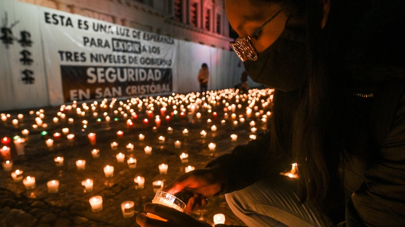 A journalist lights a candle at a vigil following a meeting of journalists in San Cristobal de las Casas earlier this month