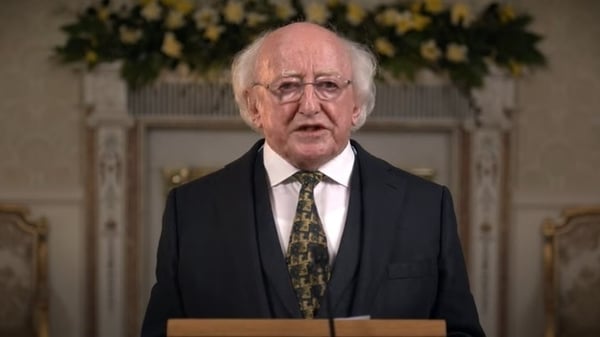 President Higgins said that a dark shadow was 'cast across our world'