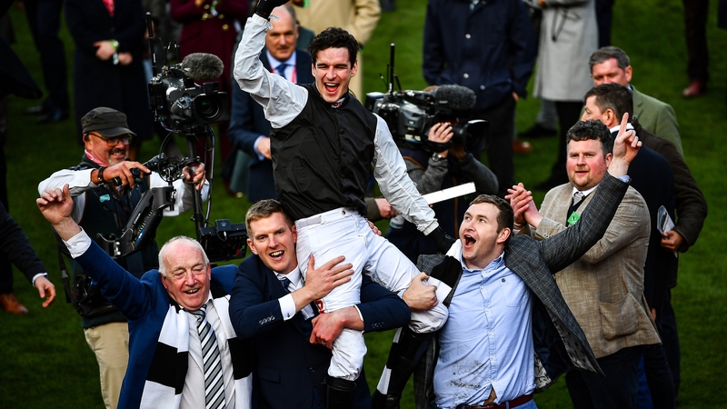 Jockey Danny Mullins is hoisted aloft by winning connections of Flooring Porter.