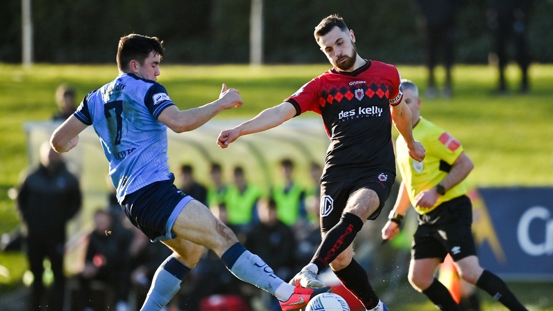 Jordan Flores of Bohemians in action against Liam Kerrigan of UCD