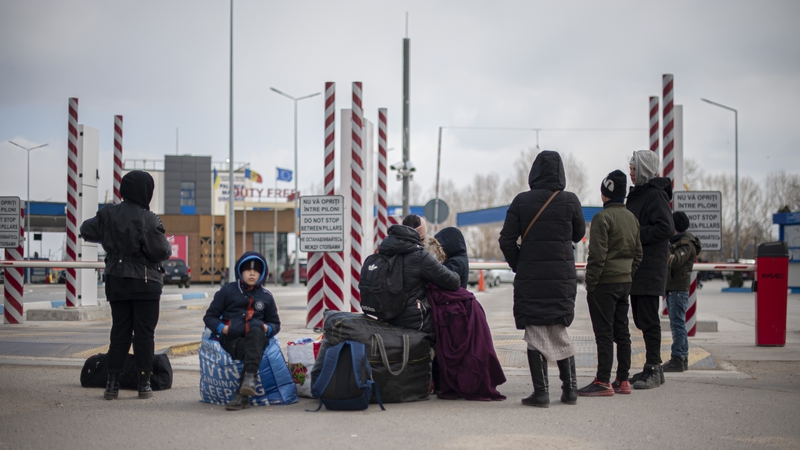 Ukrainian women and children after crossing the border with Moldova, waiting to be transported to a reception centre