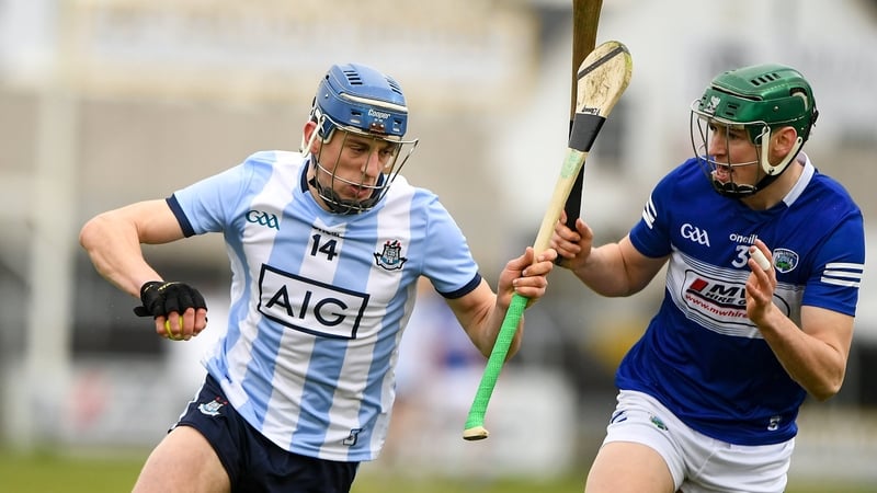 Paul Crummey of Dublin takes on Laois' Sean Downey