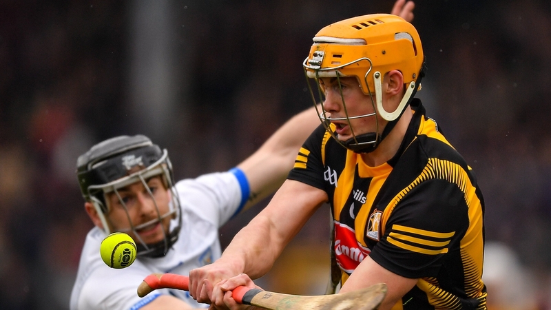 Richie Reid of Kilkenny gets a pass away under pressure from Waterford's Colin Dunford