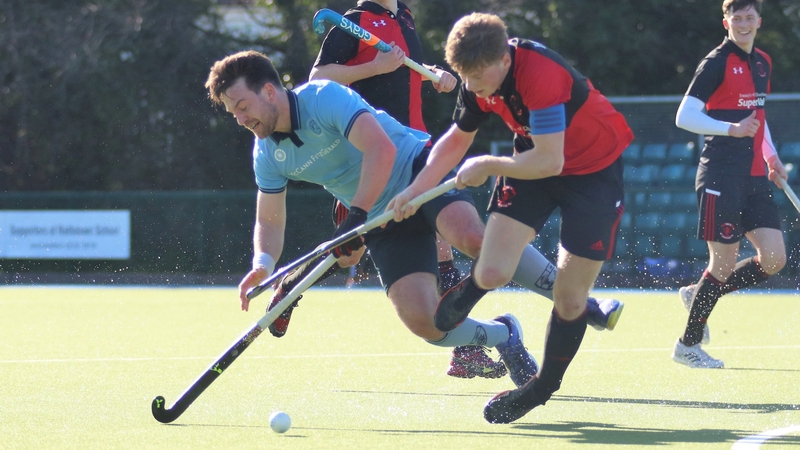 Monkstown's Jeremy Duncan and YMCA's Sam Hyland collide