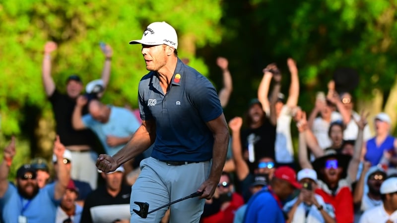 Sam Burns celebrates after sinking the winning putt in the playoff