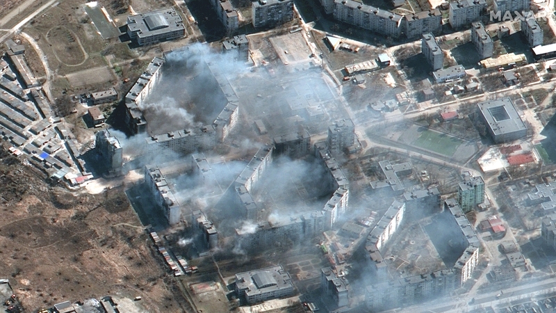 Maxar satellite imagery shows burning apartment buildings in northeastern Mariupol