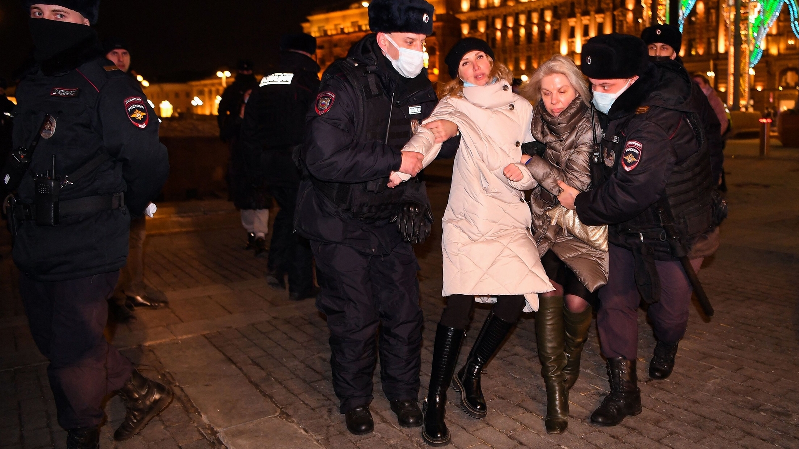 Police officers detain women during a protest against Russia's invasion of Ukraine in central Moscow
