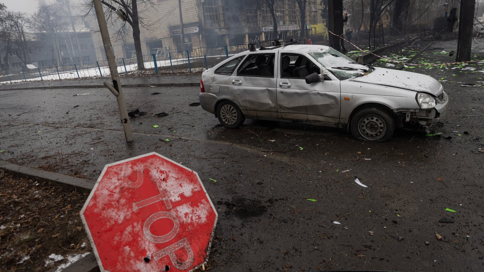 Rubble and a damaged vehicle across the street from the Kyiv TV Tower on 2 March